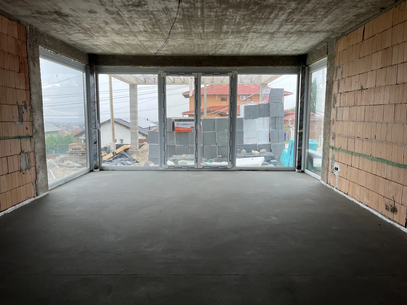 A new window fitted in a renovated house, improving thermal insulation and, in the long run, helping the insulation costs pay for themselves.